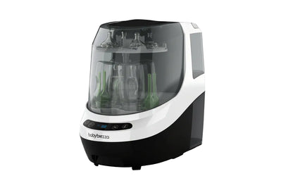 Baby bottle sterilizer with bottles inside on a white background